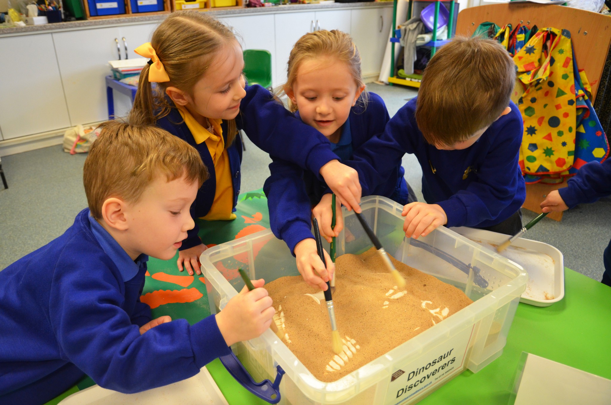 Children looking for dinosaur fossils