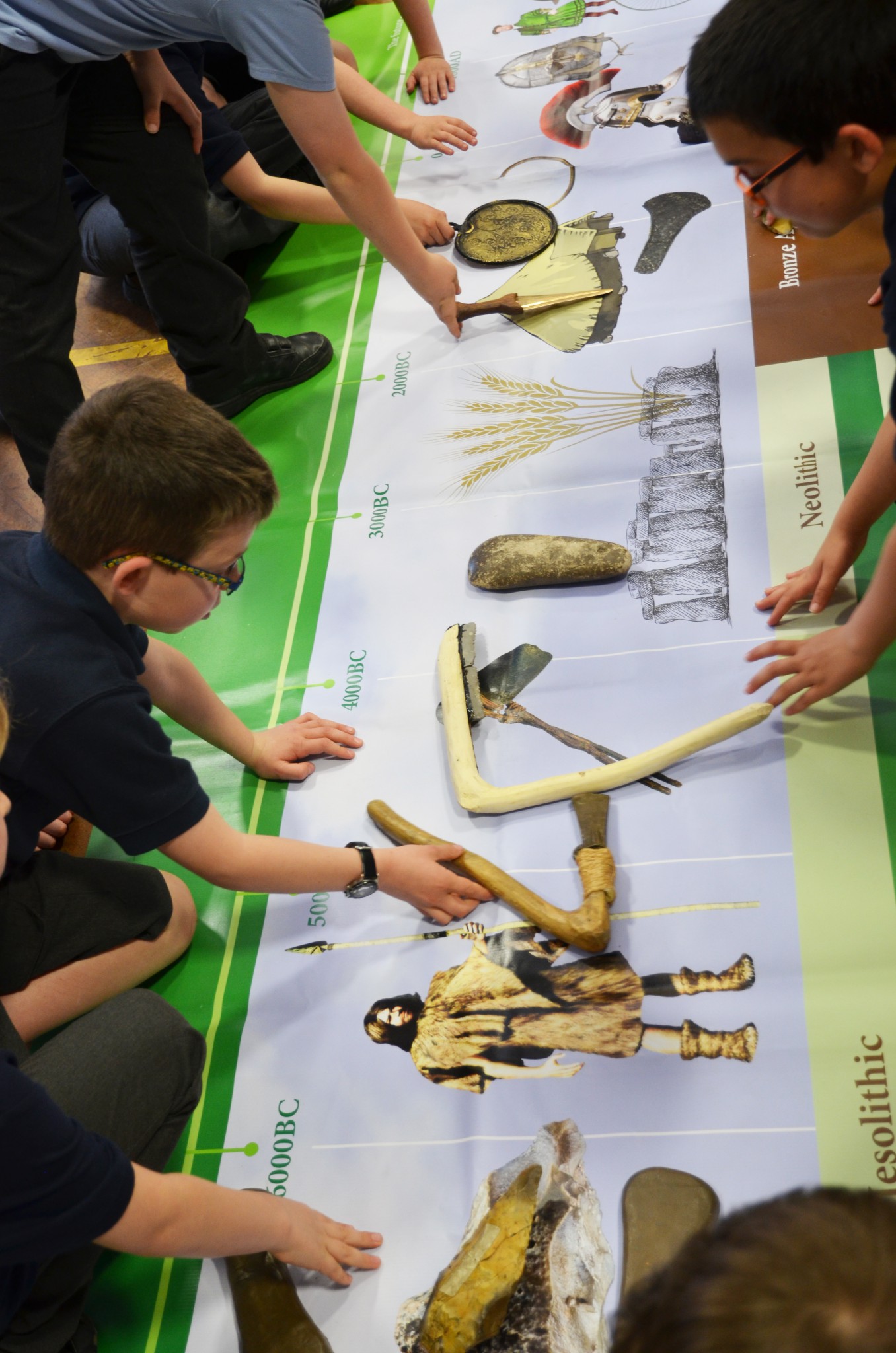 Photo of children looking at a timeline