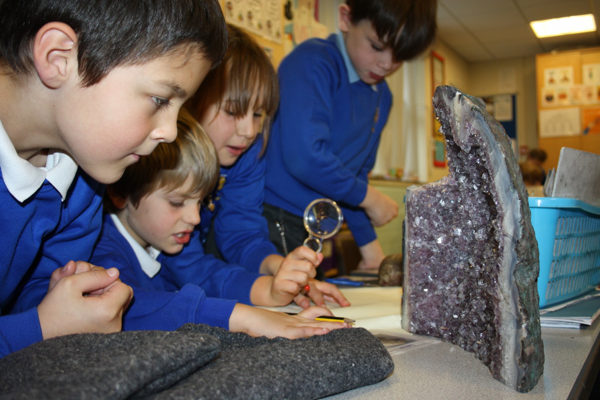 Photo of children looking at rocks