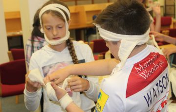 Photo of children using bandages