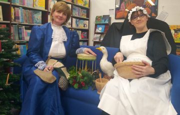 Workshop leaders dressed as a maid and a lady from Victorian times
