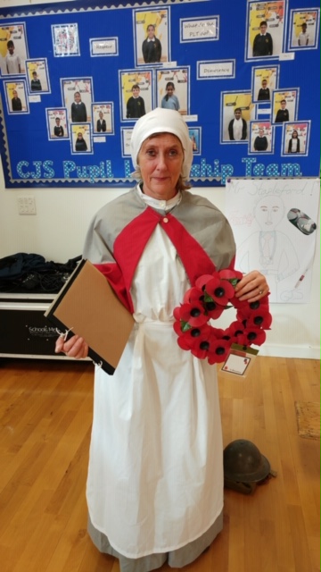 Photo of a museum educator dressed as a World War One nurse