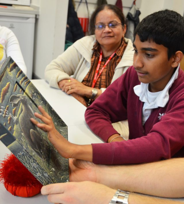 Boy looking at artwork