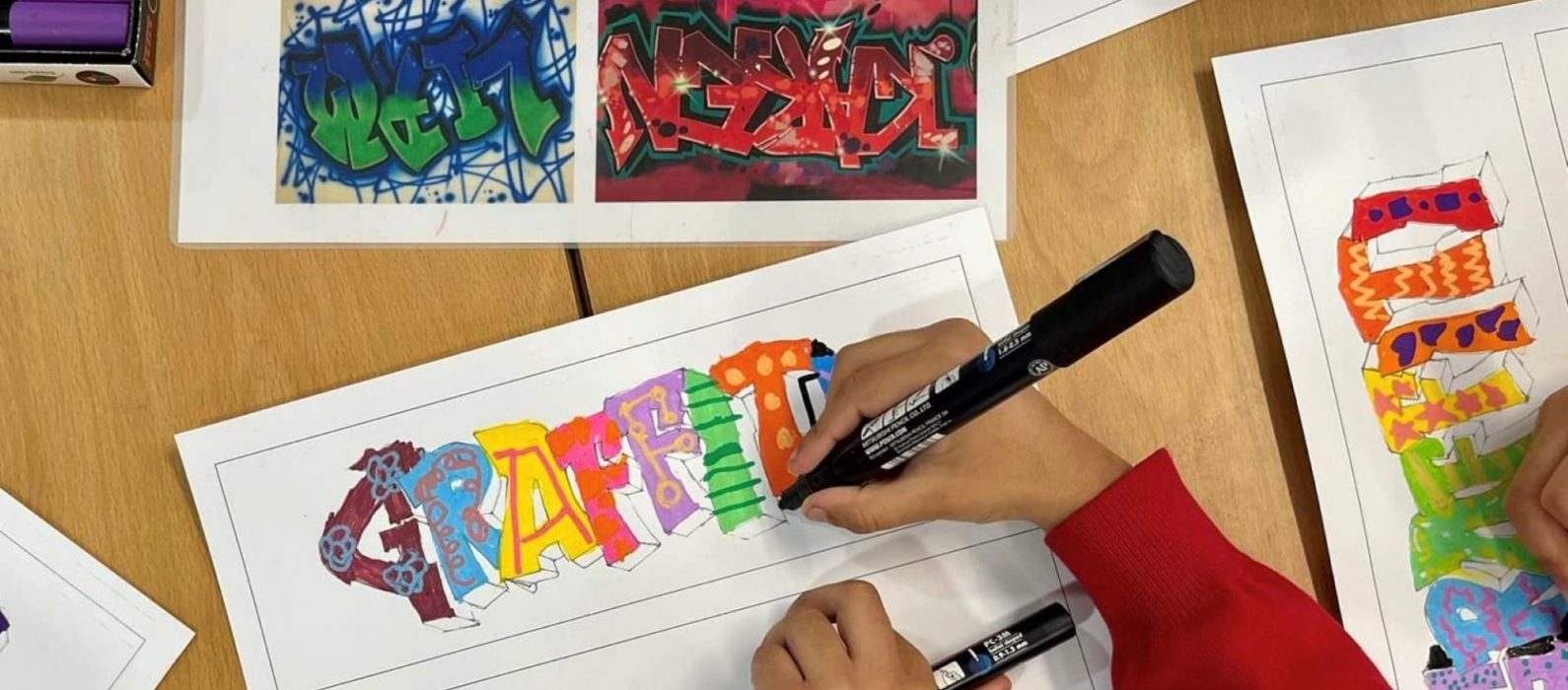 Photo of child drawing grafitti