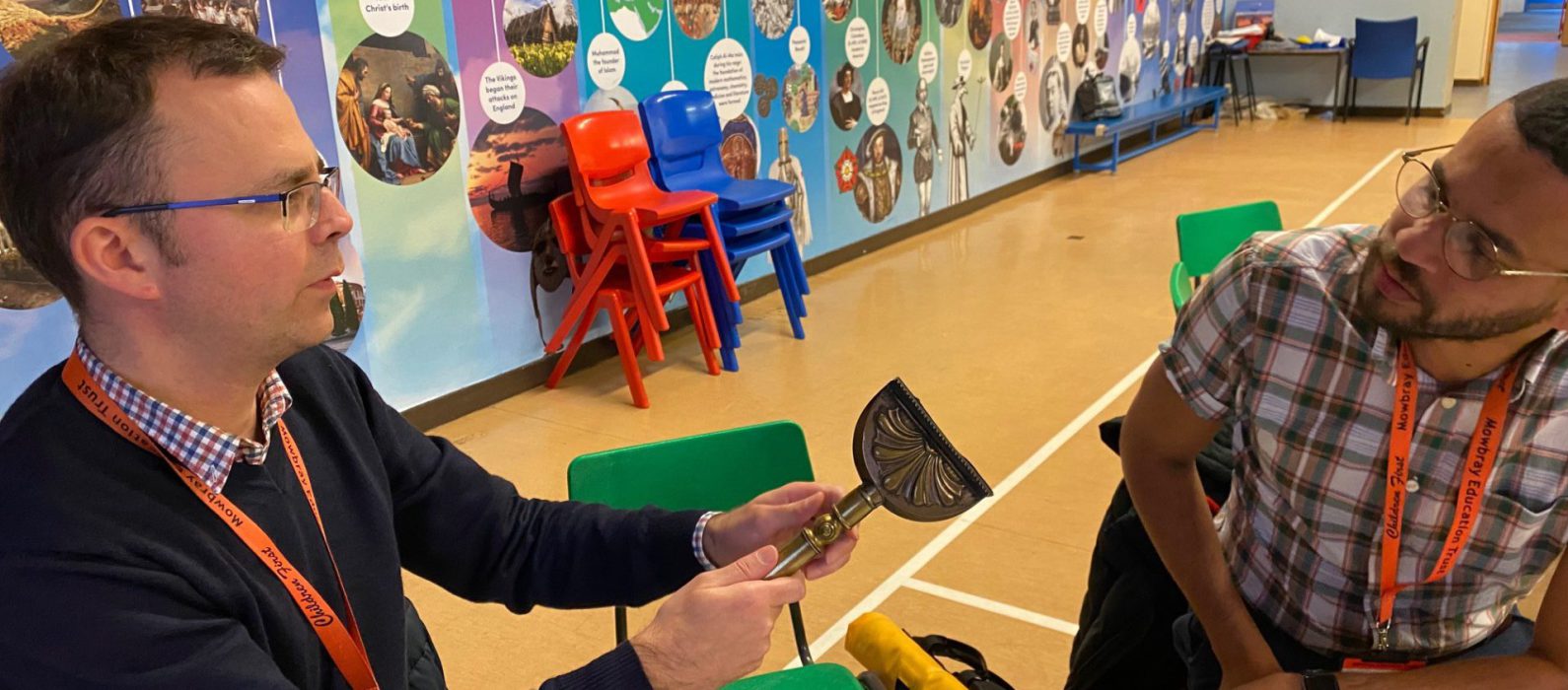 Photo of teachers using artefacts