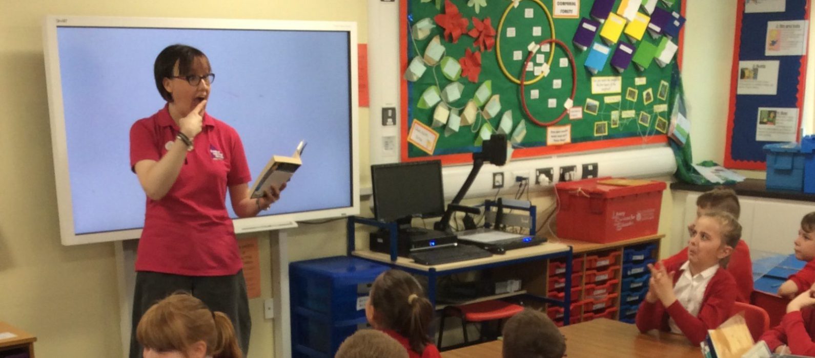 Librarian reading to pupils