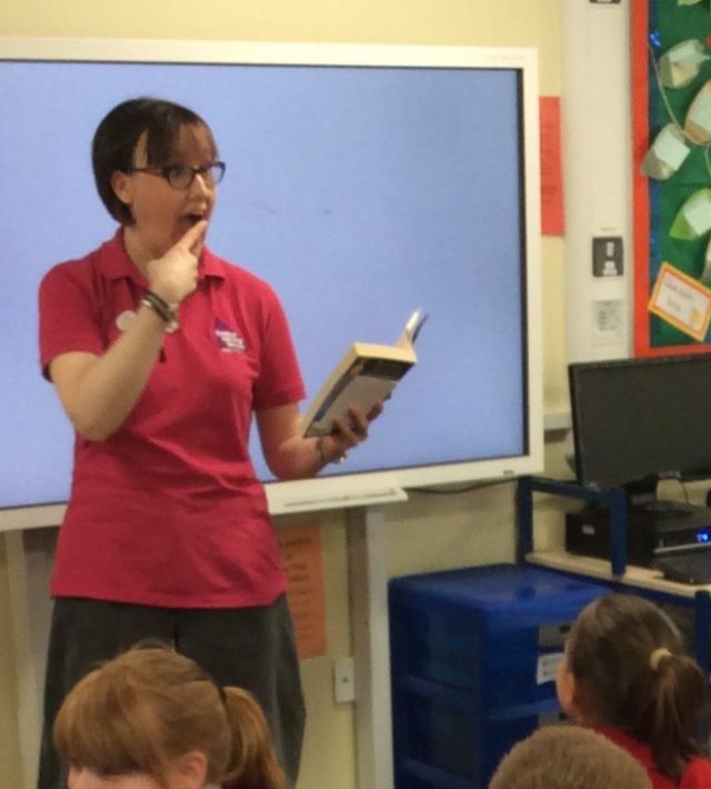 Librarian reading to pupils