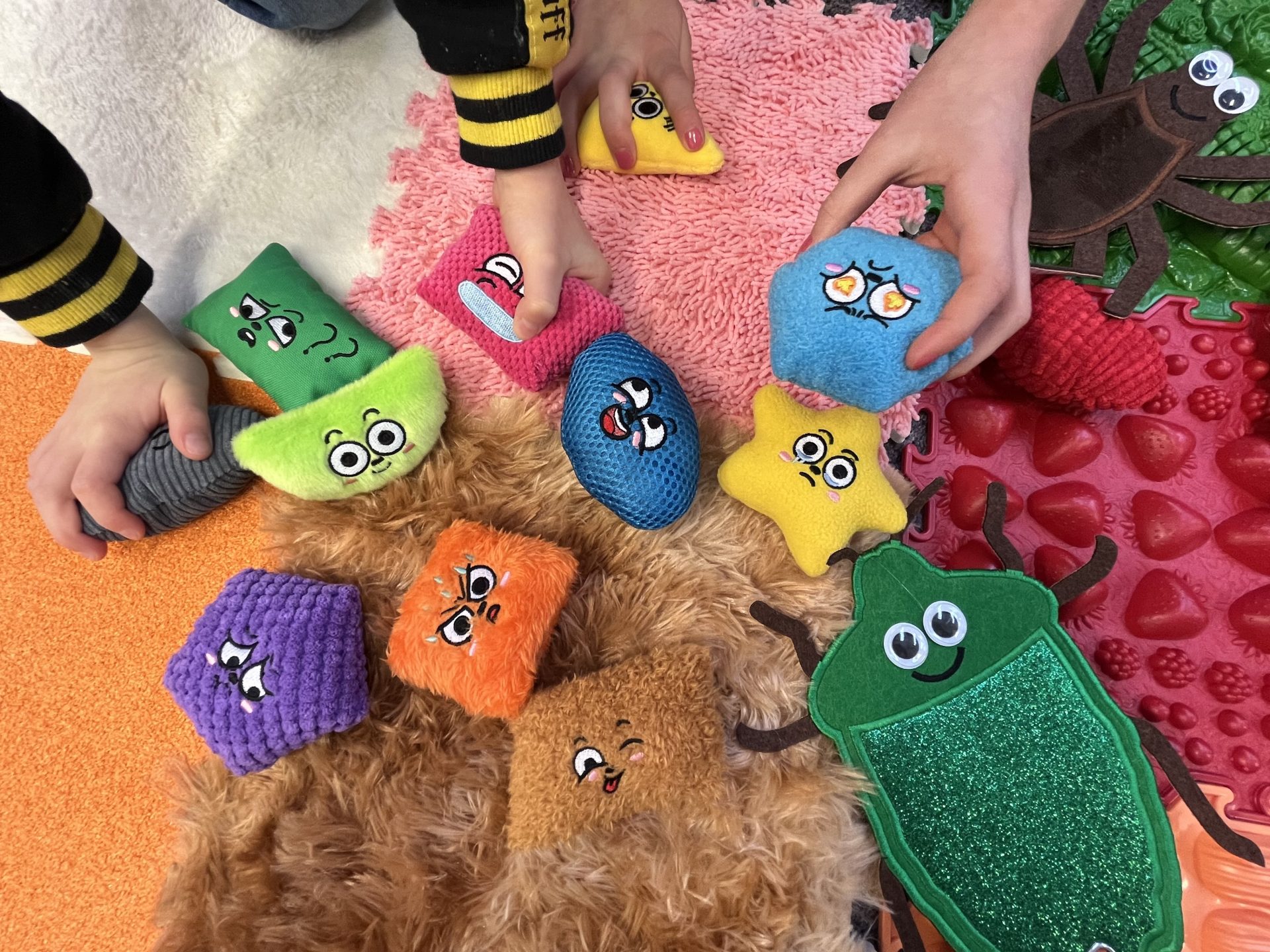 Image of hands using sensory toys