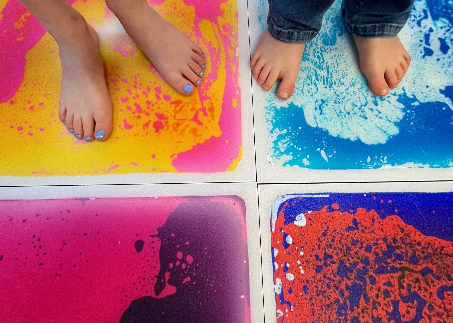 Image of feet standing on sensory tiles