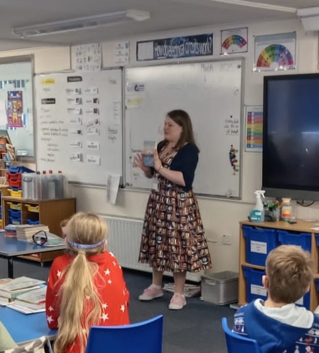 Librarian talking to students