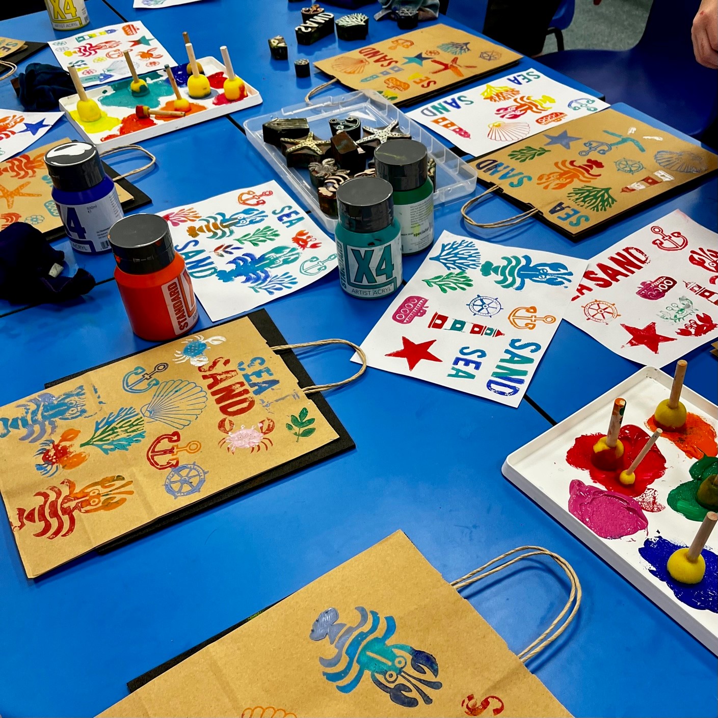 Image of bags with seaside images printed on them